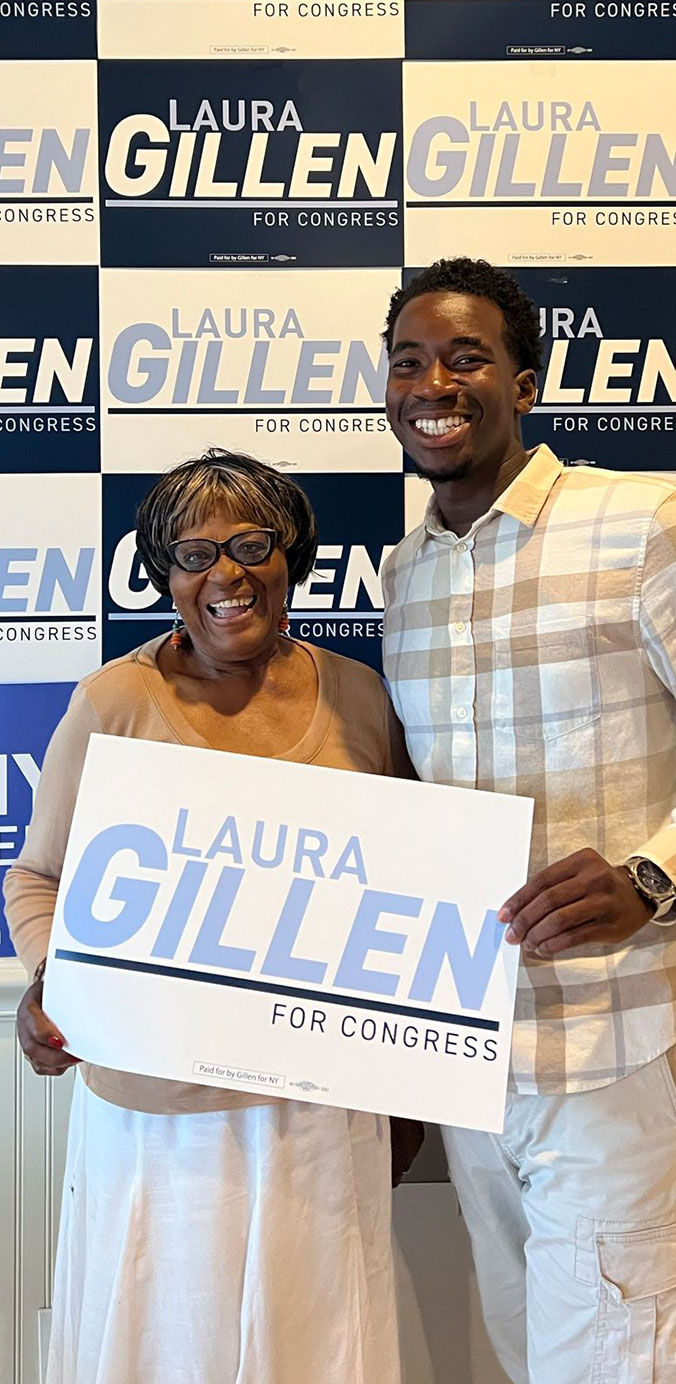 Laura Gillen supporters in front of campaign signs